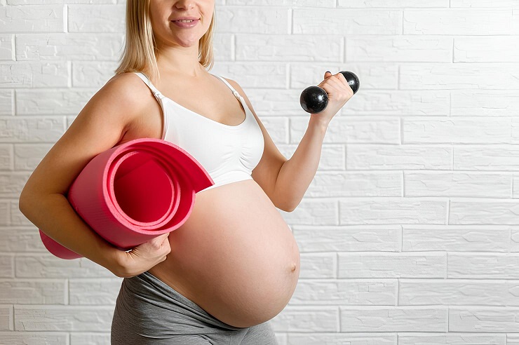 pregnant-woman-making-fitness-exercise-23-2148352216--1-