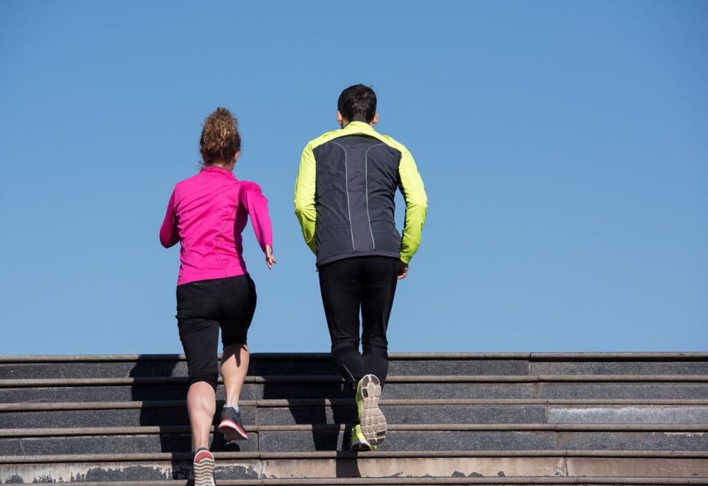 young  couple jogging on steps