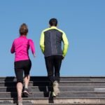 young  couple jogging on steps