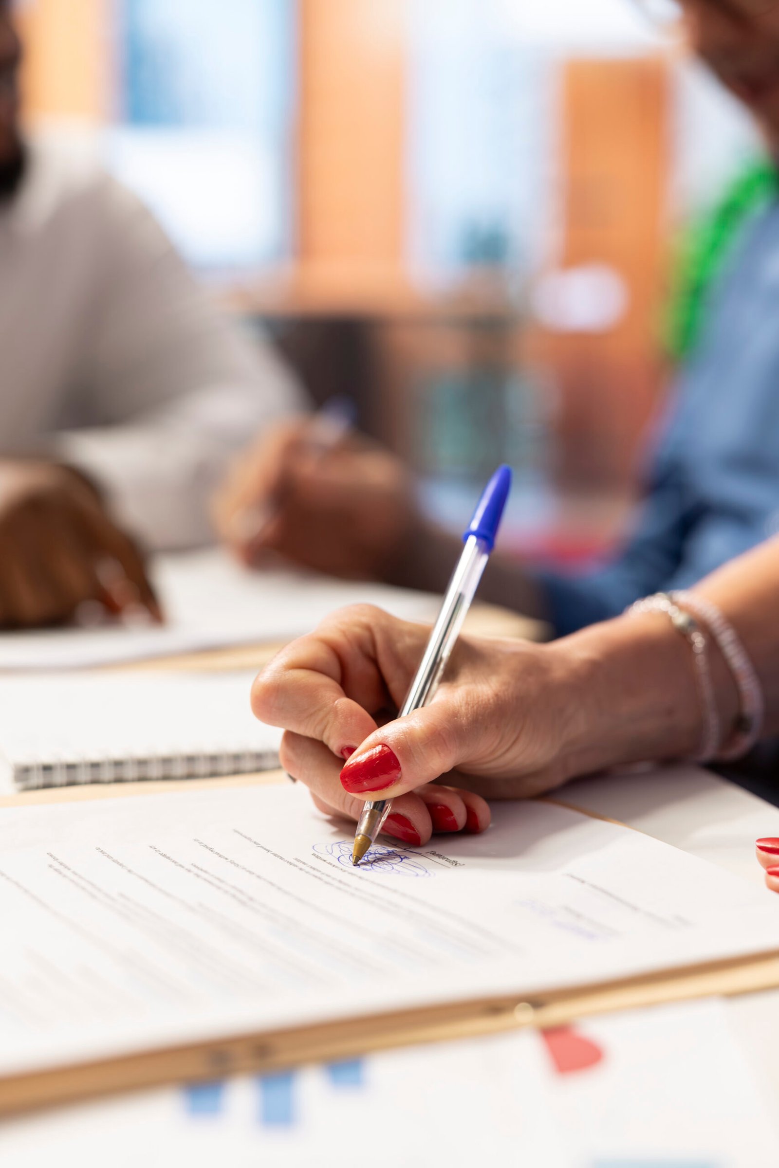 Mature client signing the pension plan contract with broker