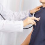 Doctor examination young man with stethoscope in hospital. healt