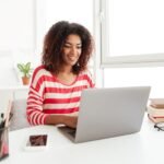 busy-woman-in-casual-clothes-working-on-laptop-at-home