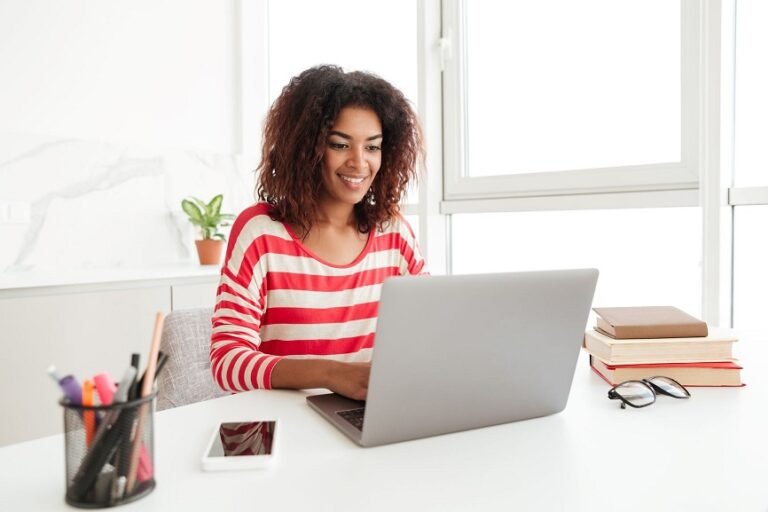 busy-woman-in-casual-clothes-working-on-laptop-at-home